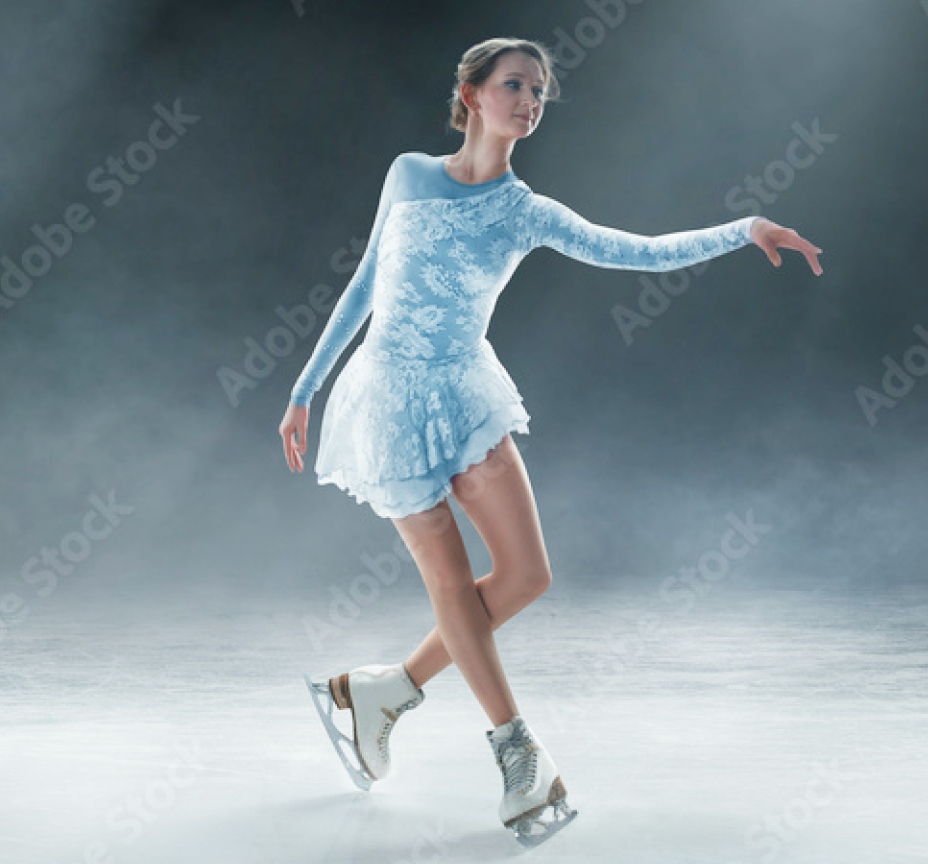 Figure skater in a light blue lace dress performing on an ice rink with arms extended and legs crossed gracefully.
