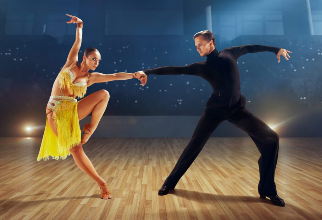 couple dancers perform latin dance on large professional stage. ballroom dancing.